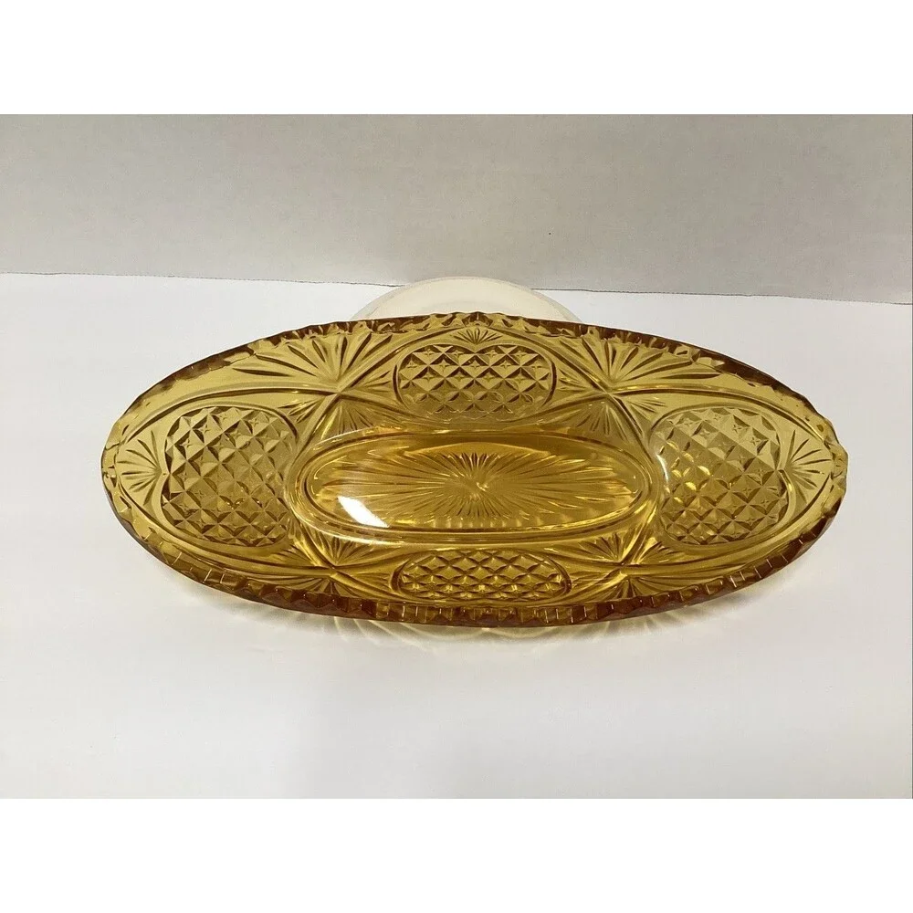 vintage amber-colored pressed glass dish scalloped rim pineapple pattern